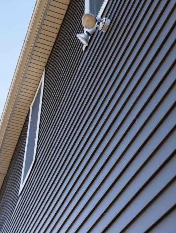 Close-up of newly installed siding on a Power Construction project